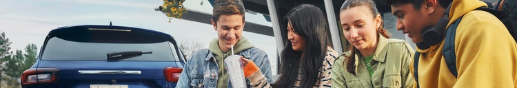 Actor portrayal of older teens sharing a beverage