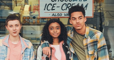 Actor portrayal of a group of older teens at an ice cream shop